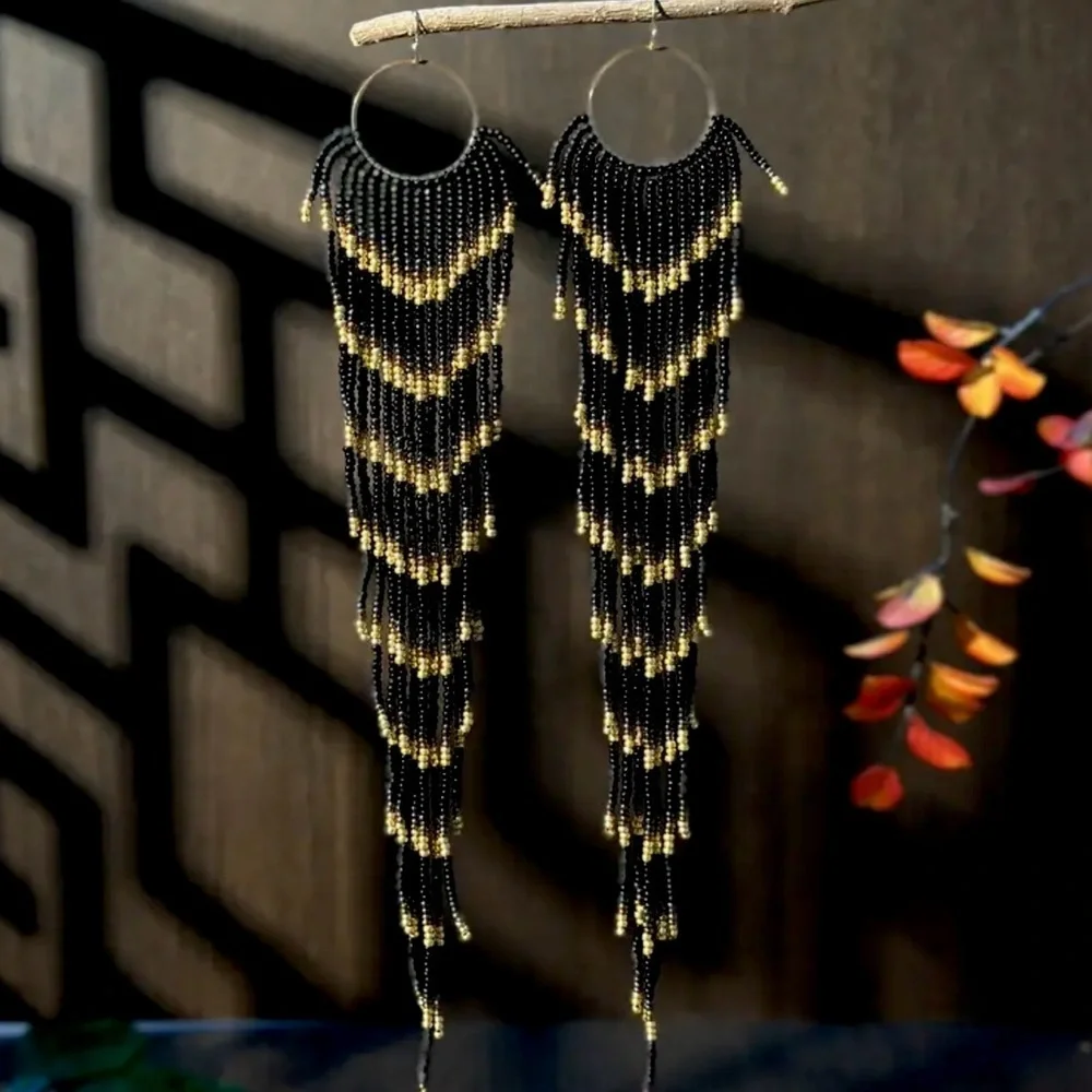Black and Gold Glass Beaded Chandelier Earrings with Cascading Feather Design